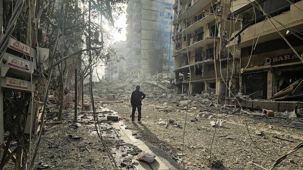 PHOTO: A man looks at the site of overnight Israeli airstrikes in the southern suburbs of Beirut on March 12, 2026.