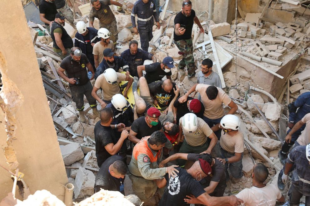 PHOTO: A survivor is taken out of the rubble after a massive explosion in Beirut, Aug. 5, 2020.