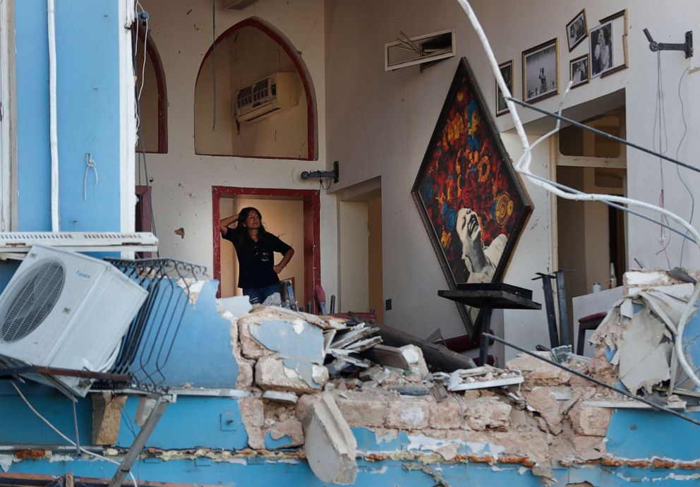 PHOTO: A woman stands inside a damaged restaurant a day after an explosion hit the seaport of Beirut, Lebanon, Aug. 5, 2020.