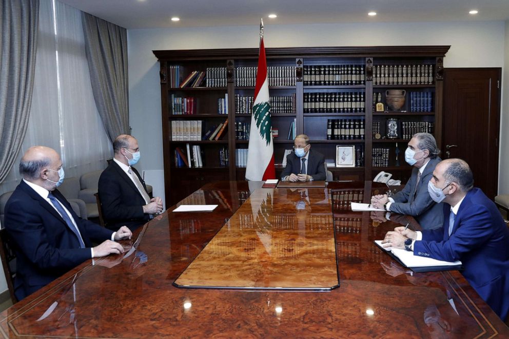 PHOTO: Lebanon's caretaker health minister Hamad Hasan meets with Lebanon's President Michel Aoun at the presidential palace in Baabda, Lebanon, Dec. 28, 2020.