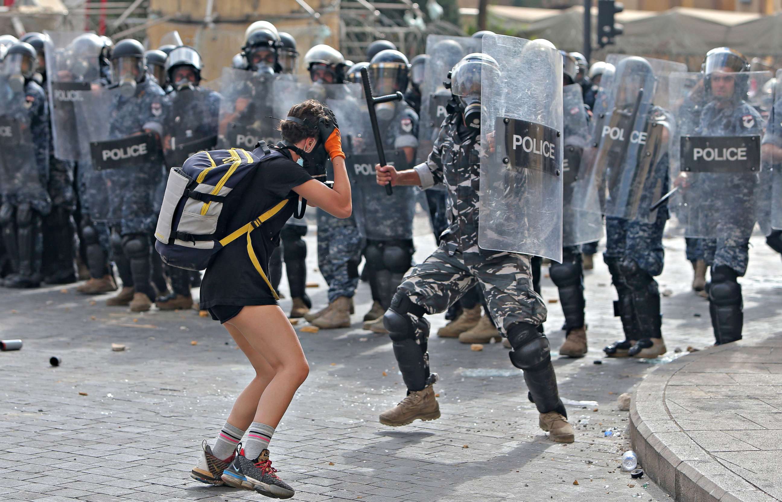 PHOTO: A policeman hits a demonstrator during clashes in downtown Beirut on Aug. 8, 2020.