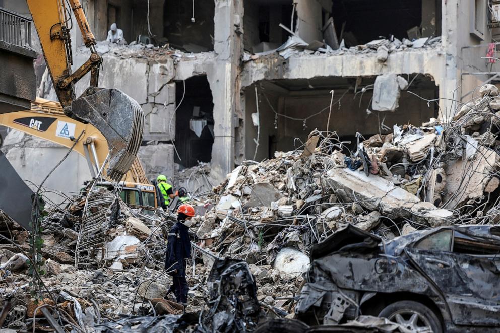 PHOTO: Civil defense members and rescuers work at the site of an Israeli strike in