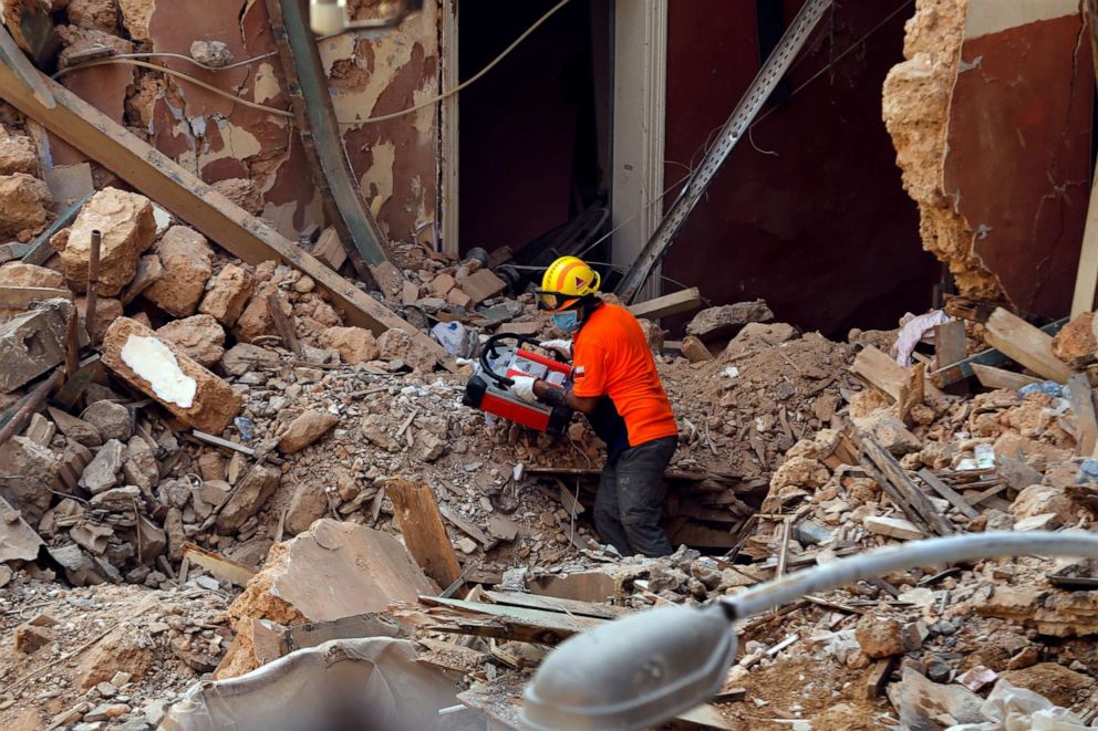 PHOTO: A Chilean rescuer holds a signal detected machine while searching in the rubble of a building that was collapsed in last month's massive explosion that hit Beirut, after getting signals there may be a survivor under the rubble, Sept. 4, 2020.