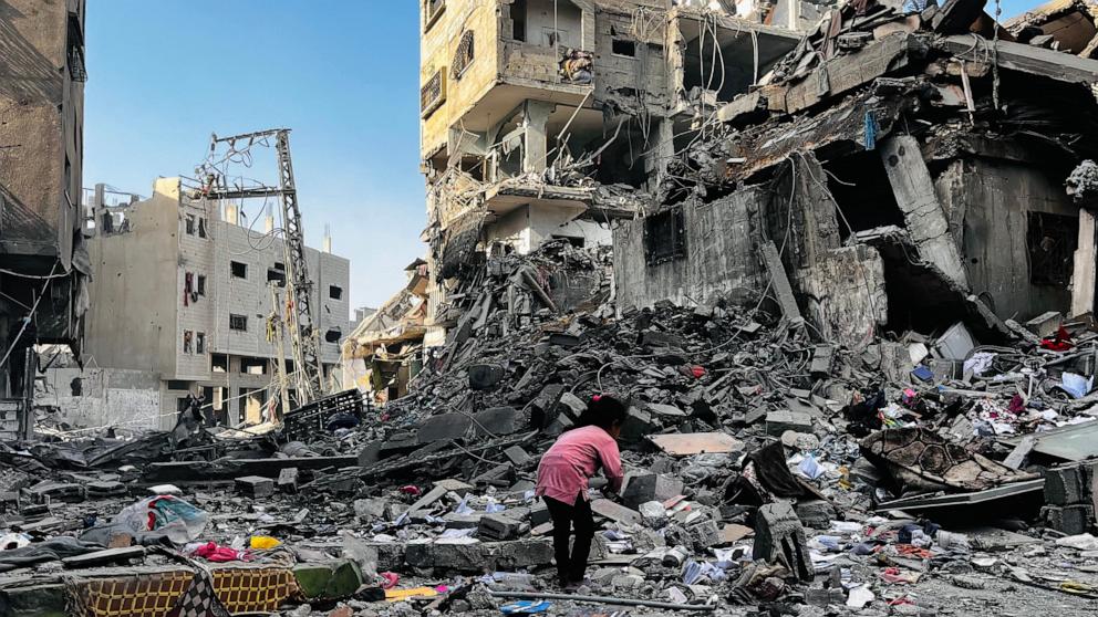 PHOTO: A Palestinian girl inspects the rubble of a building after an Israeli strike in Beit Lahia, in the northern Gaza Strip, on Oct. 29, 2024, amid the ongoing war in the Palestinian territory between Israel and Hamas.