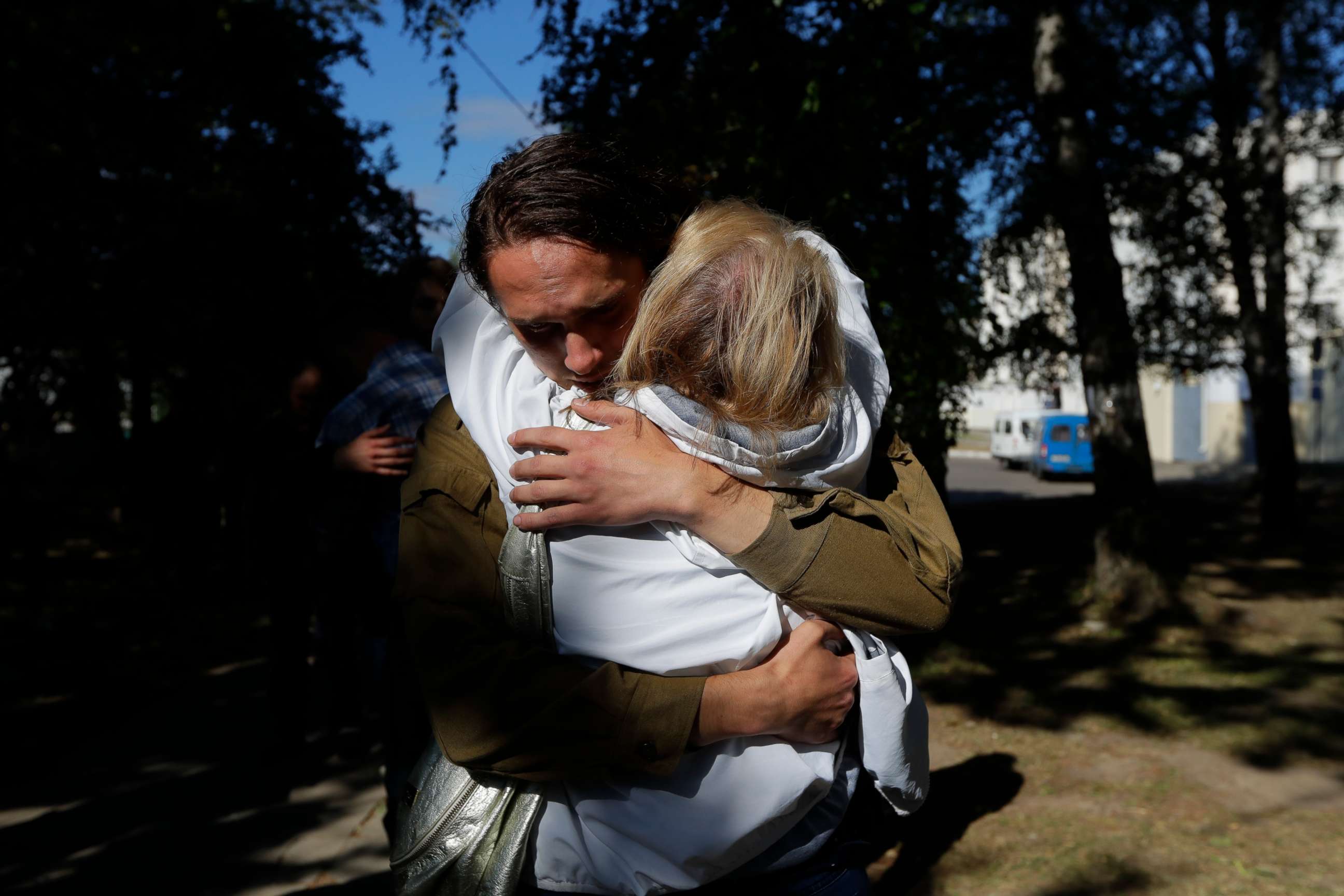 PHOTO: Men are released from a detention center where protesters were detained during a mass rally following the presidential election in Minsk, Belarus, Aug. 14, 2020.