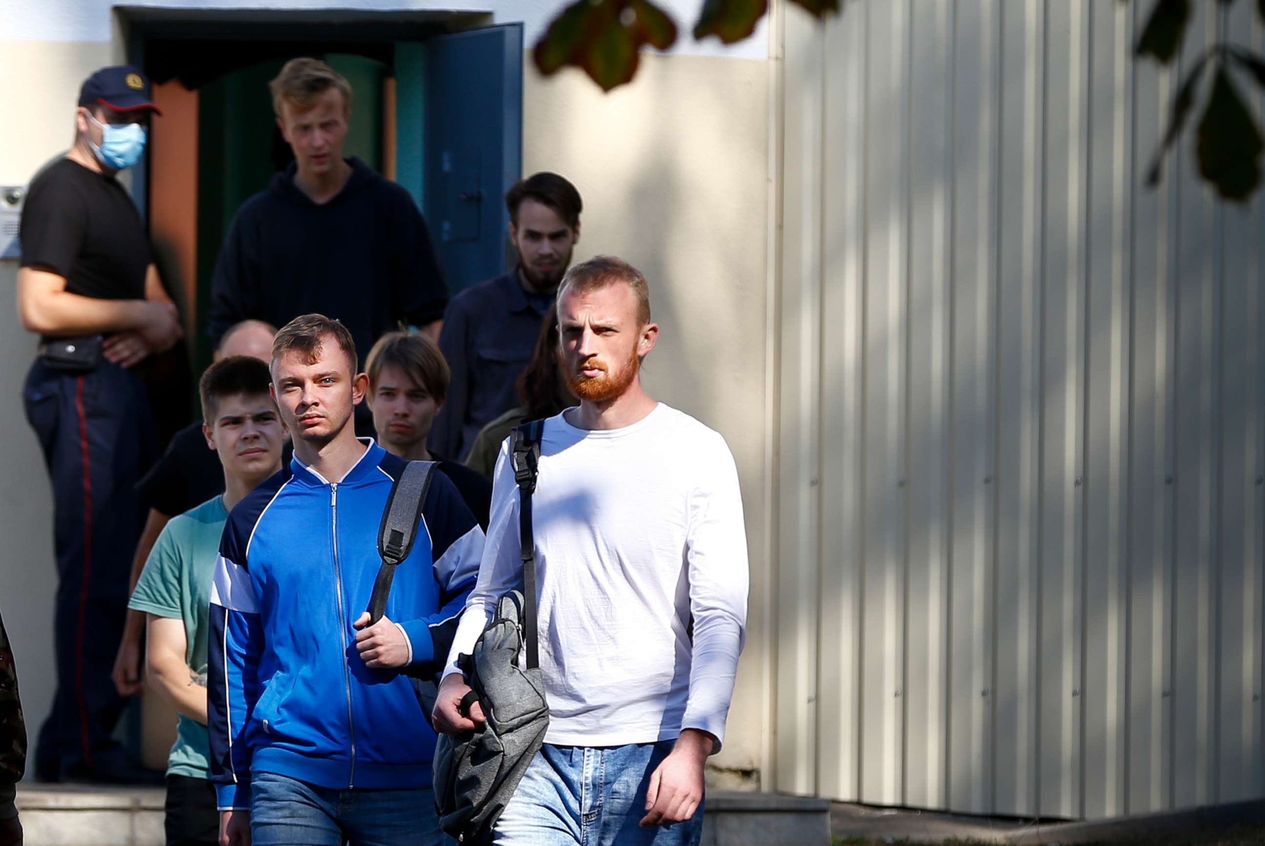 PHOTO: Men are released from a detention center where protesters were detained during a mass rally following the presidential election in Minsk, Belarus, Aug. 14, 2020.