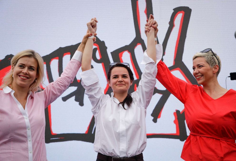 (L-R) Veronika Tsepkalo, Sviatlana Tsikhanouskaya, and Maria Kolesnikova, a representative of Viktor Babariko, raise their arms in support of Sviatlana Tsikhanouskaya in Minsk, Belarus, July 19, 2020.