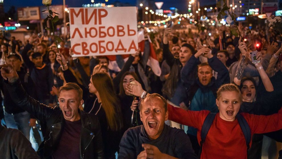 PHOTO: People shout and hold signs protesting against police violence during rallies in opposition to President Alexander Lukashenko's re-election in Minsk, Belarus, Aug. 13, 2020.