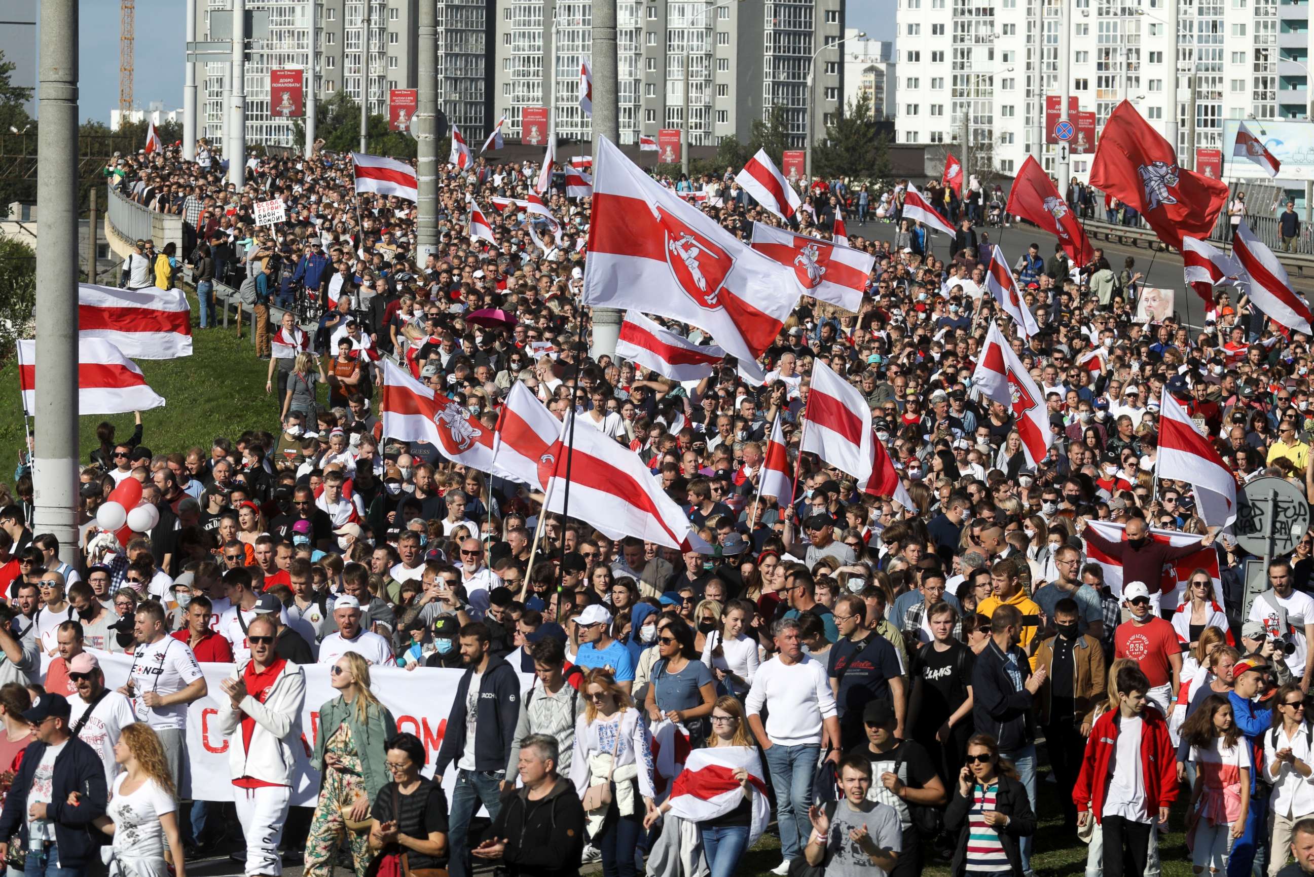 PHOTO: Protesters with old Belarusian national flags march during a Belarusian opposition supporters' rally protesting the official presidential election results in Minsk, Belarus, Sept. 13, 2020.