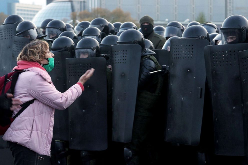 PHOTO: A woman argues with law enforcement officers during an opposition rally in Minsk, Belarus, Oct. 25, 2020.