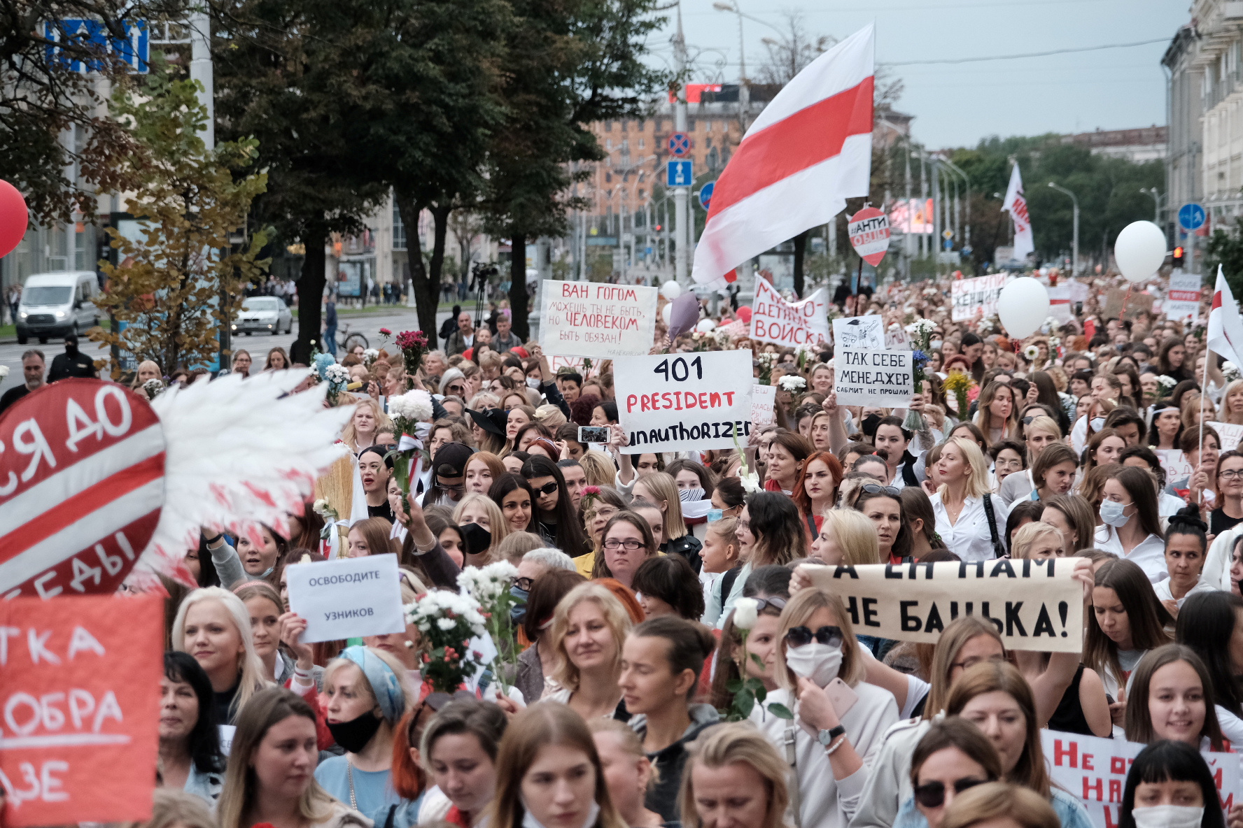 PHOTO: Women hold signs as they walk during a demonstration against police brutality following recent protests to reject the presidential election results in Minsk, Belarus, Aug. 29, 2020.