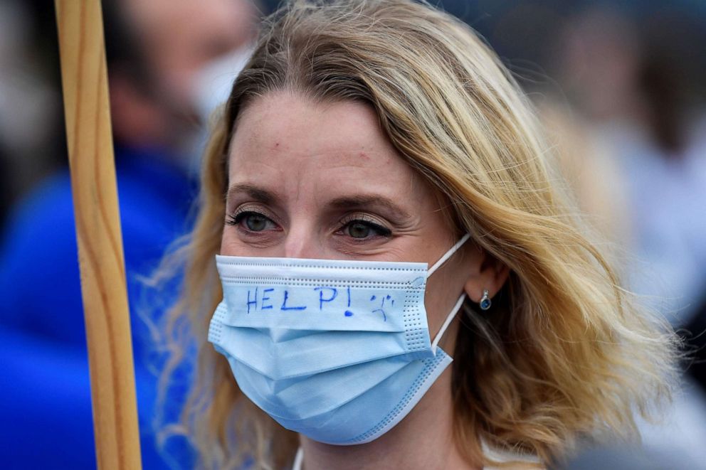 PHOTO: A woman takes part in a demonstration at the hospital MontLegia, in Liege, gathering employees, and called by the Belgian trade union National Center of Employees, on Oct. 29, 2020 as the country faces a second wave of infections from COVID-19.