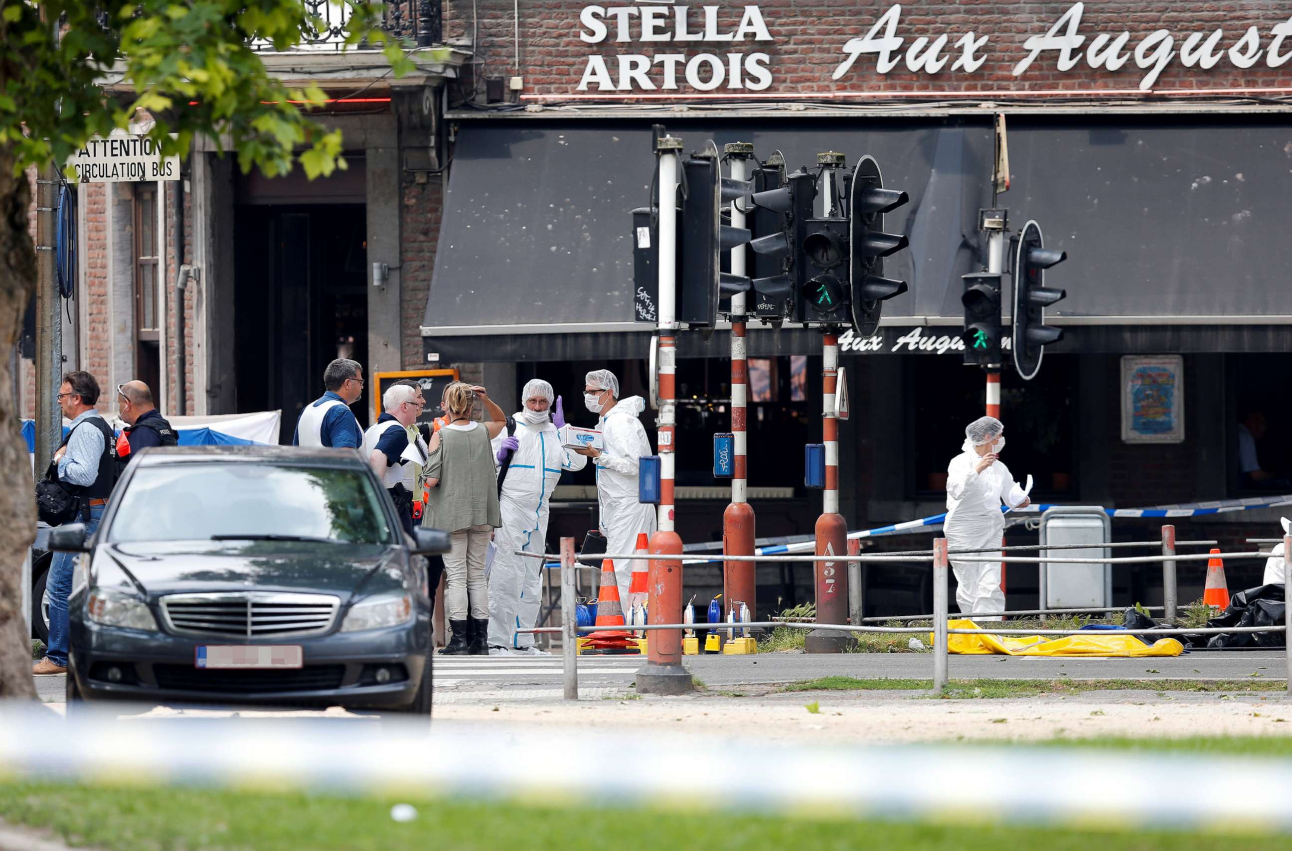 PHOTO: Police officers and forensics experts are seen on the scene of a shooting in Liege, Belgium, May 29, 2018.