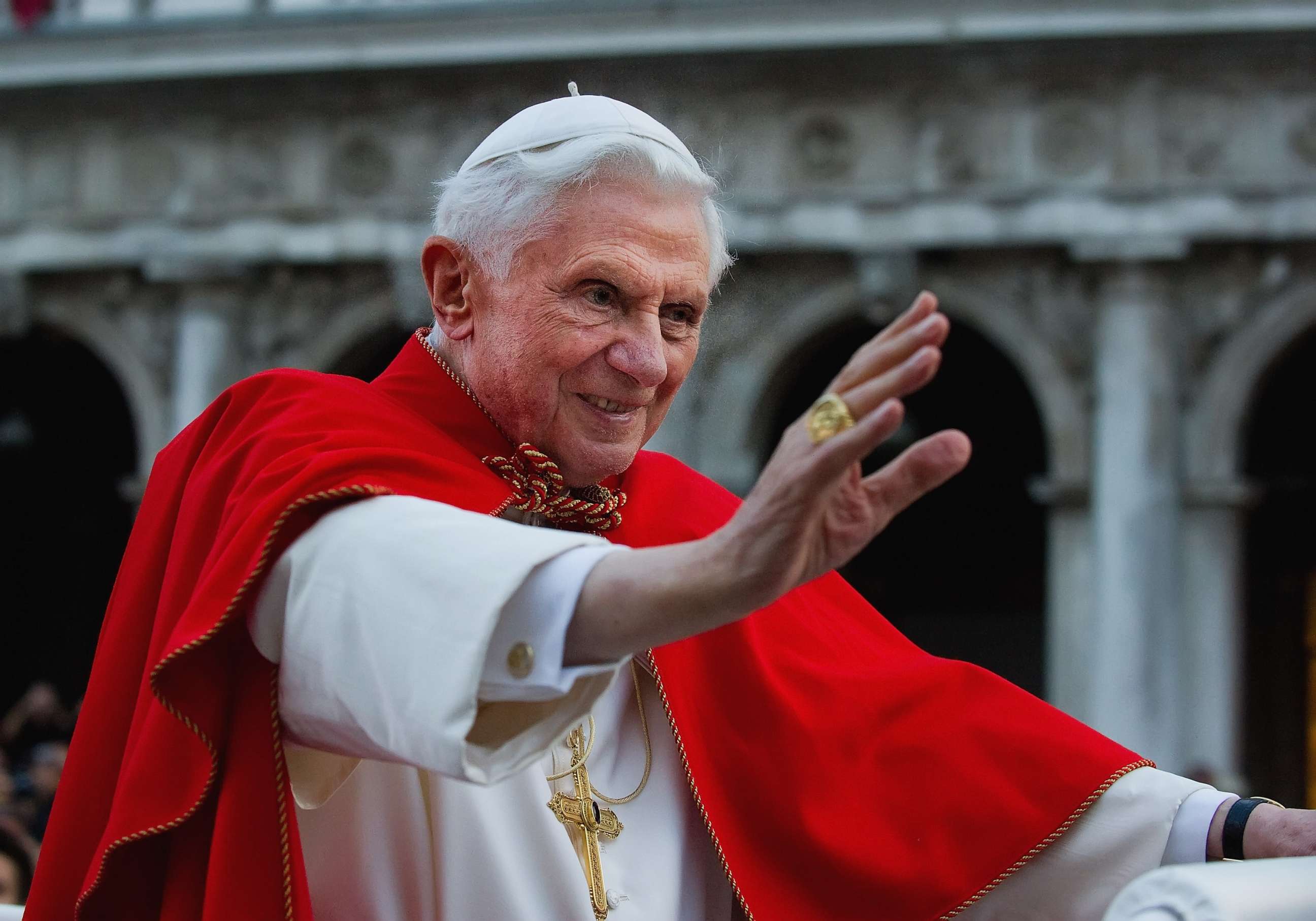FILE PHOTO: Pope Benedict XVI greets the crowd gathered in St Mark's Square while crossing the square on an electric car on May 7, 2011, in Venice, Italy.