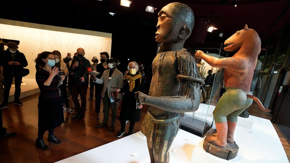 PHOTO: The royal statues of a half-man half-bird, left, of King Ghezo, and half-man half-lion of Benin's 19th century King Glele, are pictured at the Quai Branly Jacques Chirac museum, Oct. 25, 2021 in Paris.