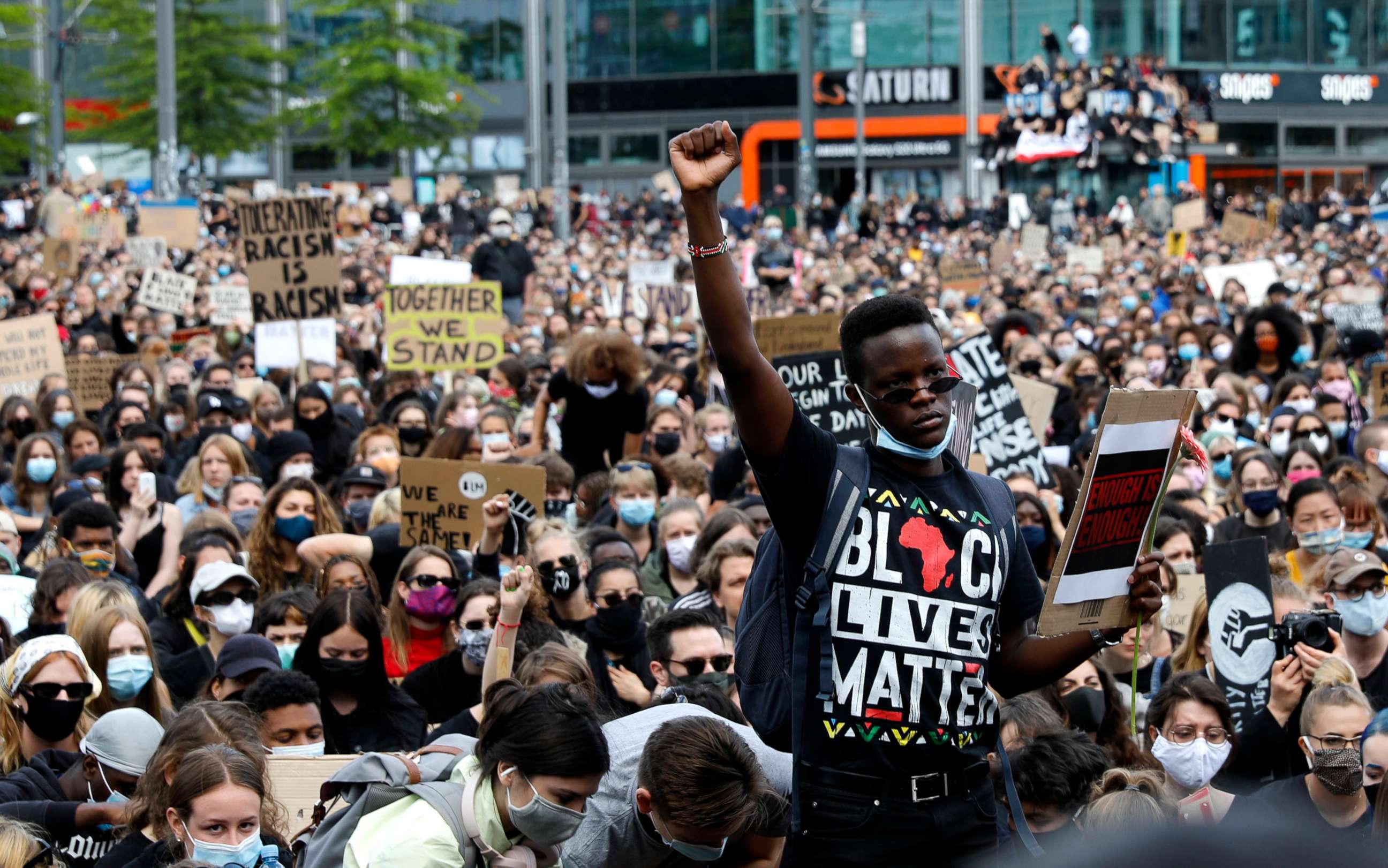 PHOTO: A man raises his fist as people gather in Berlin, June 6, 2020, to protest against the recent death of George Floyd by police officers in Minneapolis, that has led to protests in many countries and across the US.