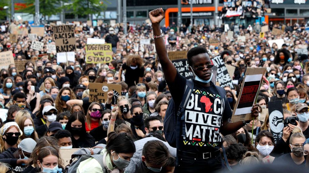 PHOTO: A man raises his fist as people gather in Berlin, June 6, 2020, to protest against the recent death of George Floyd by police officers in Minneapolis, that has led to protests in many countries and across the US.