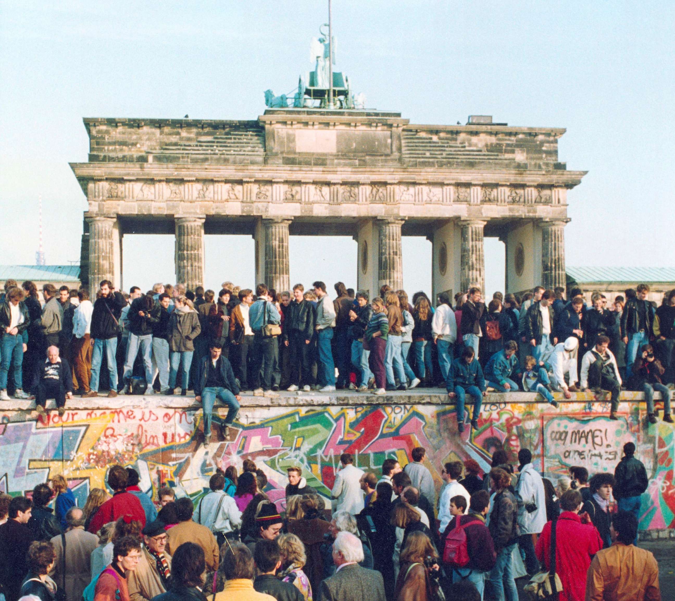 PHOTO: In this Nov. 10, 1989, file photo, Germans from East and West stand on the Berlin Wall in front of the Brandenburg Gate in Berlin.