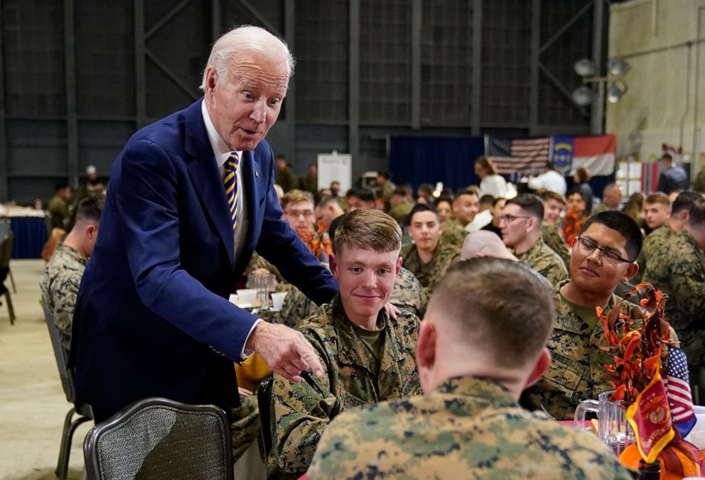 PHOTO: President Joe Biden talks with guests at Marine Corps Air Station Cherry Point in Havelock, N.C., Nov. 21, 2022, at a Thanksgiving dinner with members of the military and their families.