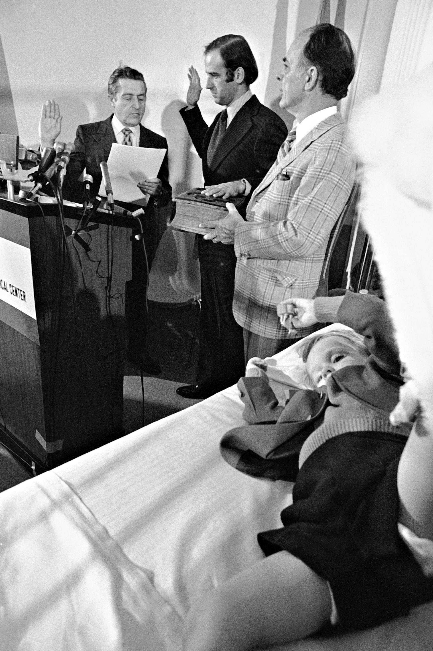 PHOTO: Four-year-old Beau Biden, foreground, watches his father, Joe Biden, being sworn in as the U.S. senator from Delaware by Senate Secretary Frank Valeo, left, in ceremonies in a Wilmington hospital, Jan. 5, 1973.