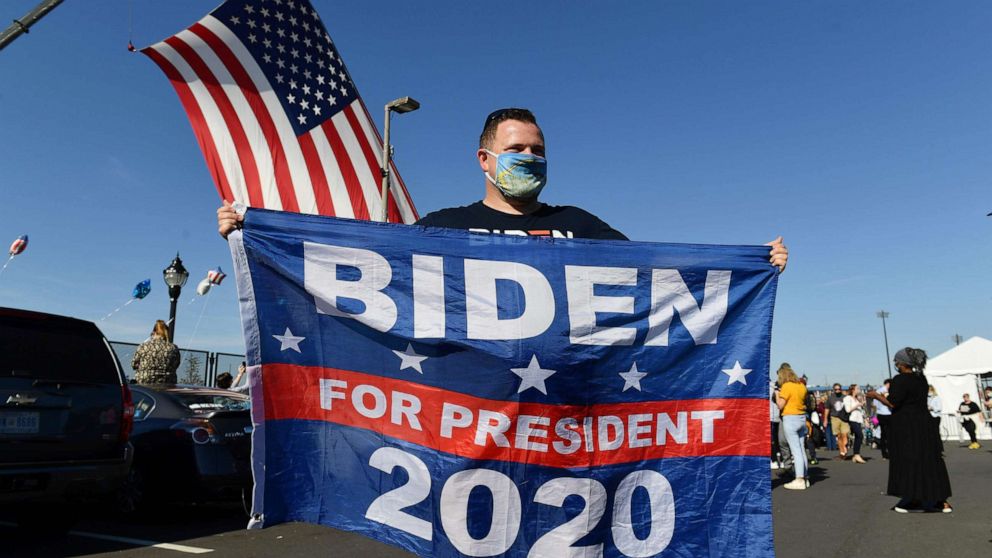 PHOTO: A supporter of former vice-president Joe Biden celebrates in Wilmington, Del. on Nov. 7, 2020.