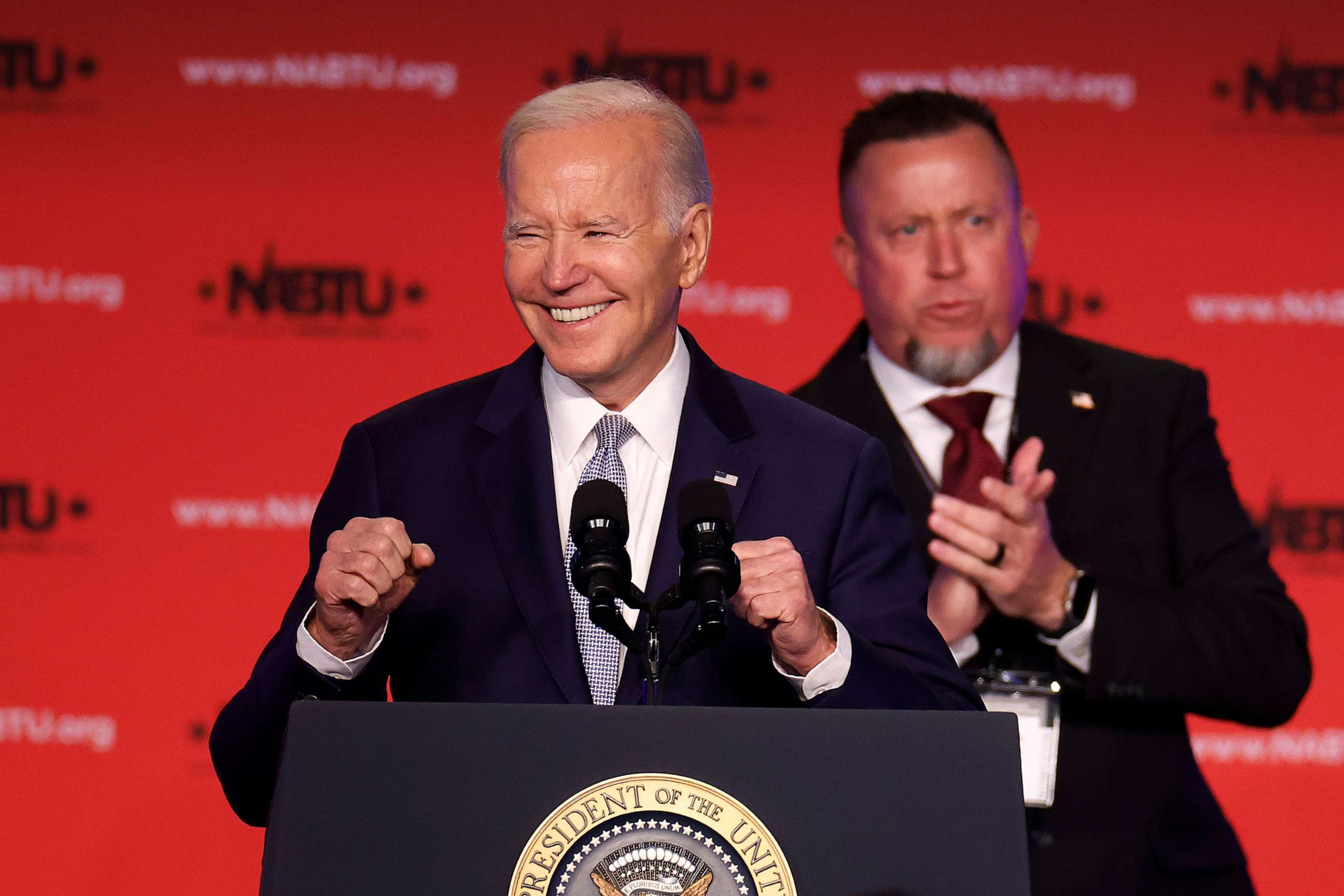 PHOTO: President Joe Biden is welcomed to the stage by North America's Building Trades Unions Secretary-Treasurer Brandon Bish during their legislative conference at the Washington Hilton, on April 25, 2023, in Washington, D.C.