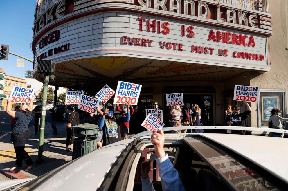 PHOTO: Supporters of Joe Biden and Kamala Harris celebrate in Oakland, Calif., on Nov. 7, 2020.