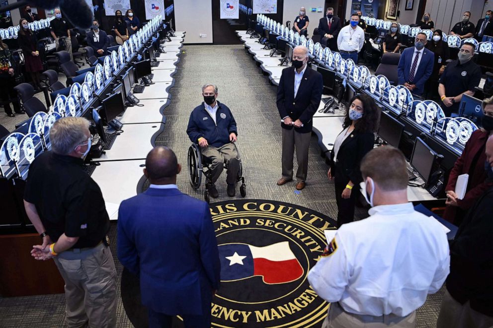 PHOTO: President Joe Biden and Texas Governor Greg Abbott, center left, listen to officials at the Harris County Emergency Operations Center in Houston, Feb. 26, 2021.