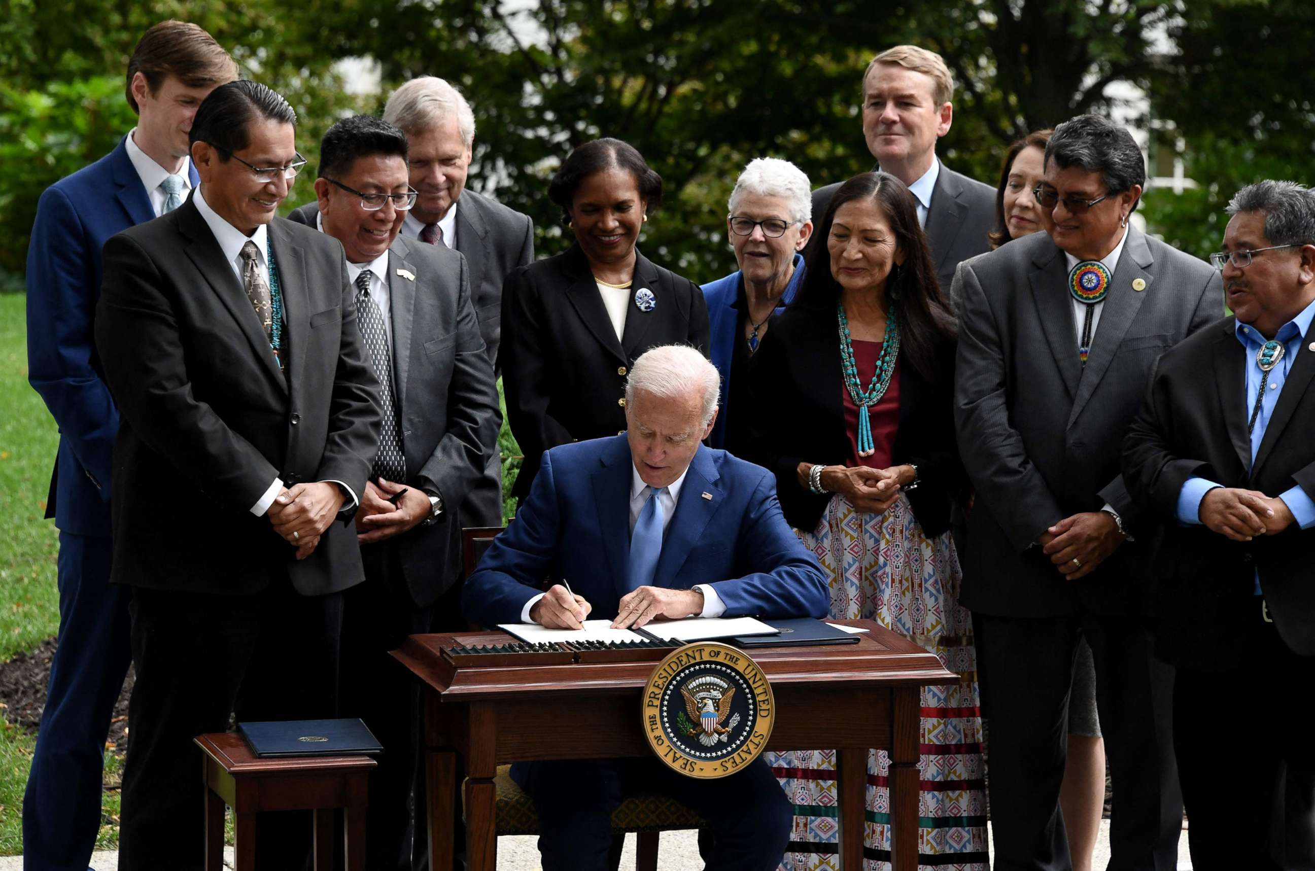 PHOTO: President Joe Biden signs three proclamations restoring protections for Bears Ears, Grand Staircase-Escalante, and Northeast Canyons and Seamounts National Monuments, on the North Lawn of the White House in Washington, Oct. 8, 2021.