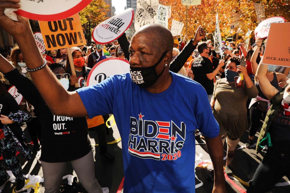 PHOTO: People celebrate Joe Biden's lead outside of the Philadelphia Convention Center as the counting of ballots continues in the state on Nov. 06, 2020, in Philadelphia.