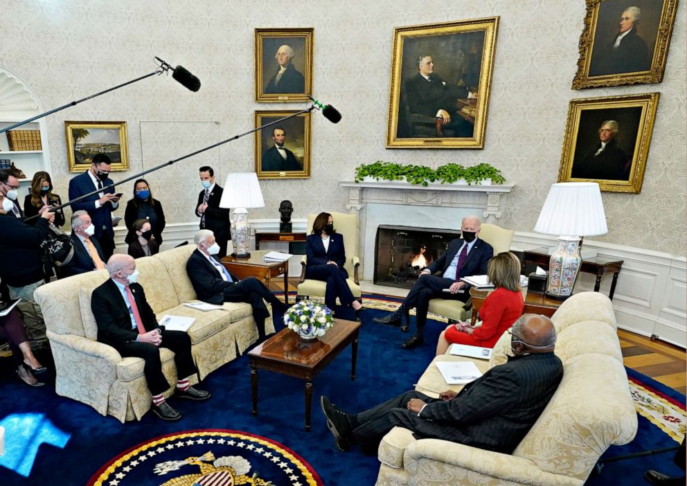 PHOTO: President Joe Biden, accompanied by Vice President Kamala Harris, speaks with House Speaker Nancy Pelosi, House Majority Whip James Clyburn, House Majority Leader Steny Hoyer, Rep. Peter DeFazio in the Oval Office of the White House.