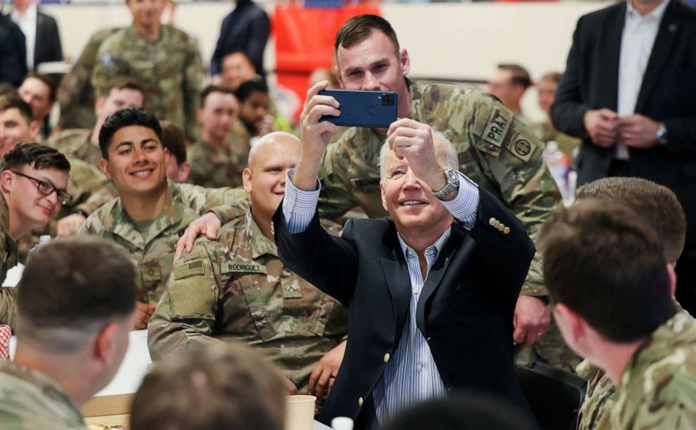 PHOTO: President Joe Biden takes a selfie with U.S. Army soldiers assigned to the 82nd Airborne Division at the G2 Arena in Jasionka, near Rzeszow, Poland, March 25, 2022.