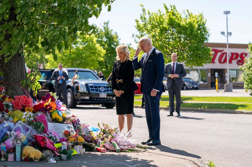 PHOTO: President Joe Biden and first lady Jill Biden visit a memorial near the scene of a May 14 mass shooting at Tops supermarket in Buffalo, New York on May 17, 2022.