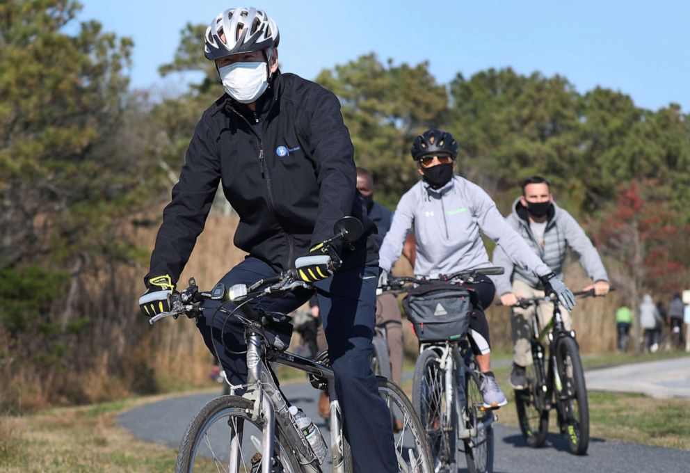 PHOTO: President Elect Joe Biden and his wife Jill Biden take a bike ride through Cape Henlopen State Park on Nov.14, 2020, in Lewes, Del.