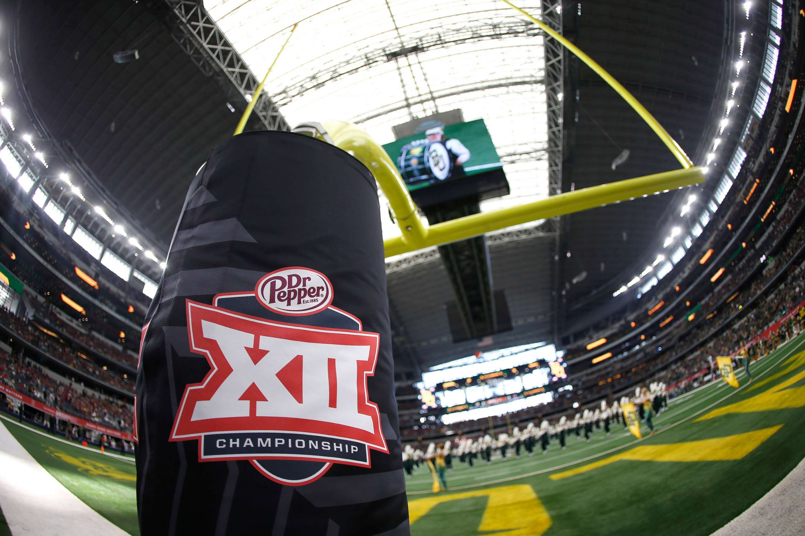 PHOTO: In this Dec. 7, 2019, file photo, a Big 12 logo is shown as the Baylor Bears band plays on the field before Baylor plays the Oklahoma Sooners in the Big 12 Football Championship at AT&T Stadium in Arlington, Texas.