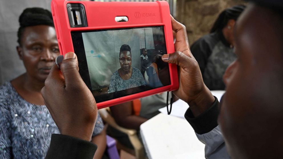 PHOTO: A Kenyan woman looks at a biometric camera prior to register for the Huduma Namba, May, 17, 2019, in Nairobi.