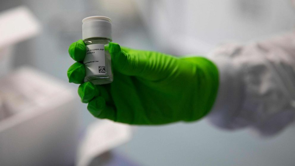 PHOTO: An employee holds up a vial of an oncological product under development, at the BioNTech research institute in Mainz, Rhineland-Palatinate, western Germany, on Oct. 5, 2022.