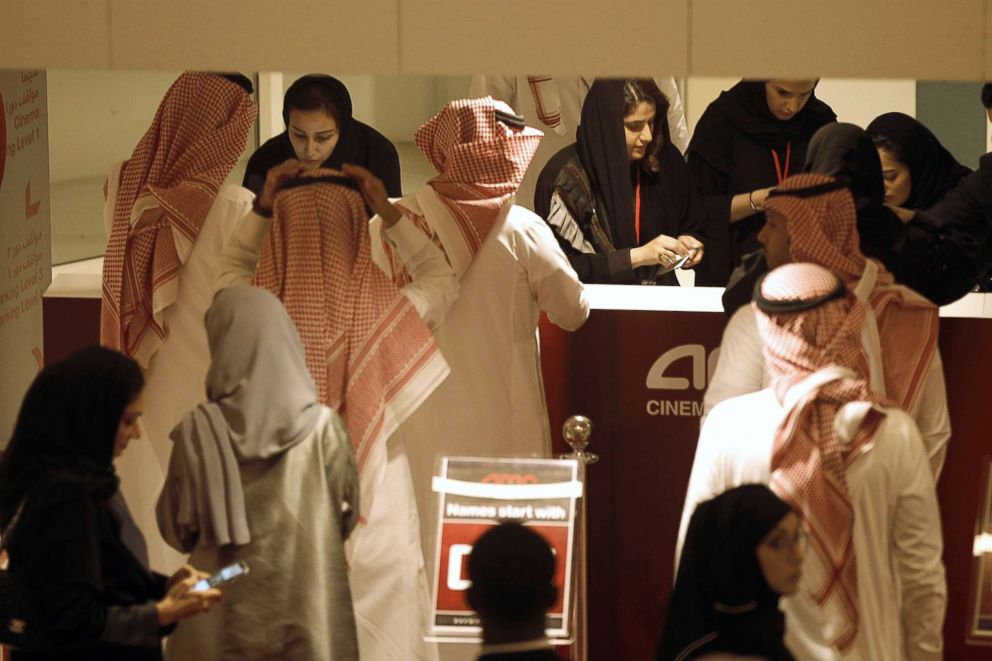 PHOTO: Saudi moviegoers buy tickets at the box office during the opening of the AMC Entertainment cinema theatre at the King Abdullah Financial District in Riyadh, Saudi Arabia, April 18, 2018.