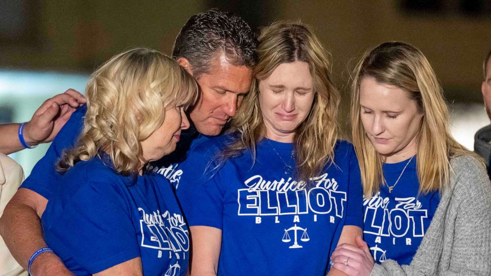 PHOTO: Kimberly Williams, second from right, the wife of Elliot Blair, is comforted by her family during a candlelight vigil in Orange, Calif., Jan 26, 2023, for Orange County deputy public defender Elliot Blair who died in Mexico.