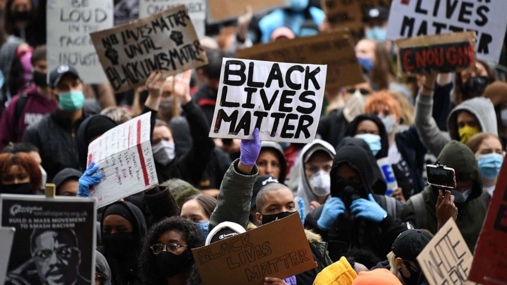PHOTO: People attend a demonstration in Parliament Square in central London, on June 6, 2020, to show solidarity with the Black Lives Matter movement in the U.S. in the wake of the death of George Floyd in Minneapolis police custody.