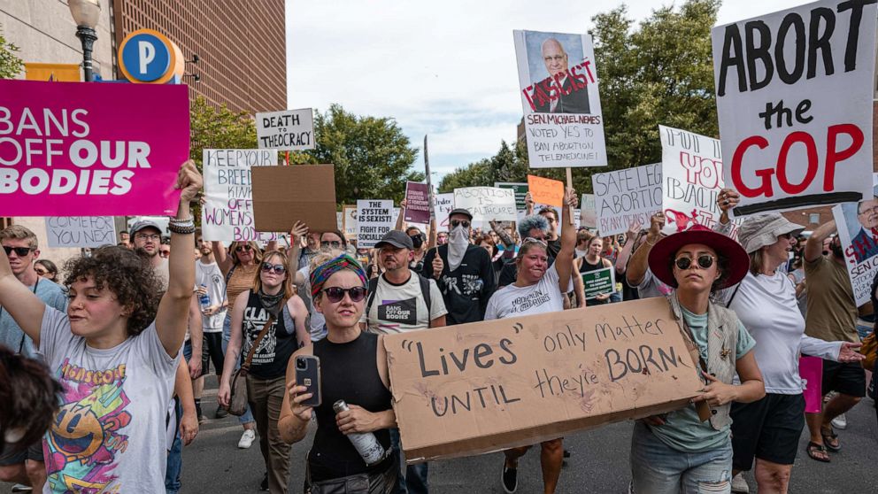 PHOTO: Abortion rights advocates chant and display signs at gathering in dissent of the Supreme Court's decision in the Dobbs v Jackson Women's Health case which removed a federal right to abortion, Louisville, Ky., June 24, 2022.