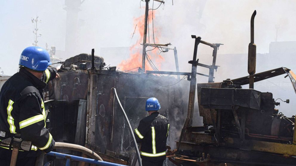 PHOTO: Ukrainian firefighters battle a fire on a boat burning in the port of Odessa after missiles hit the port of Odessa, Ukraine, July 23, 2022.