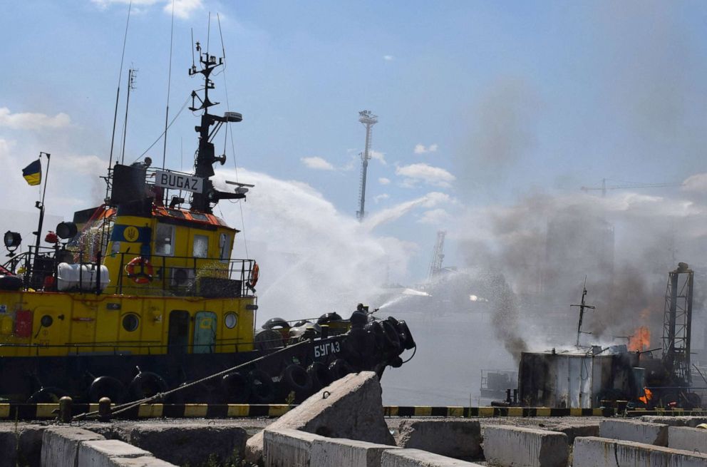 PHOTO: Ukrainian firefighters battle a fire on a boat burning in the port of Odessa after missiles hit the port of Odessa, Ukraine, July 23, 2022.