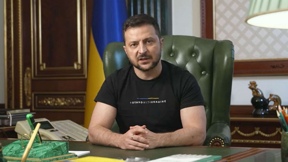 PHOTO: Ukrainian President Volodymyr Zelenskyy delivers his evening address while wearing a shirt with the message "Stand with Ukraine" on it, Sept. 22, 2022.