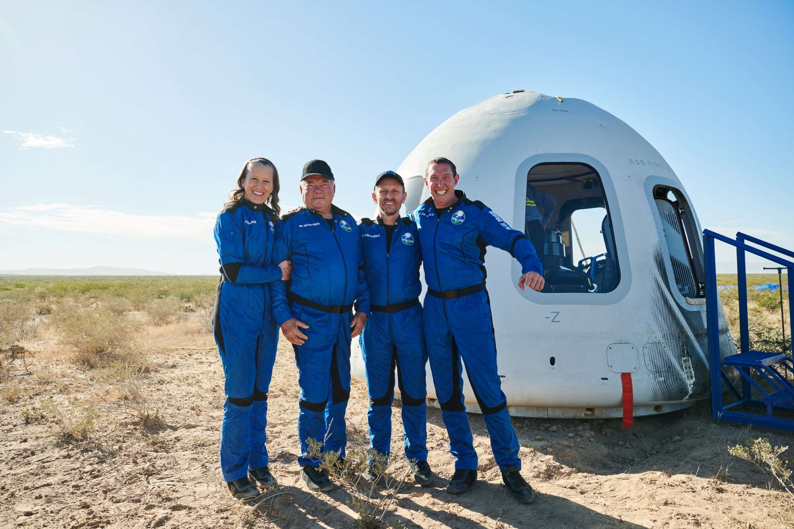 PHOTO: Star Trek actor William Shatner poses with Audrey Powers, Chris Boshuizen, and Glen de Vries after the capsule landing of the Blue Origin New Shepard mission NS-18 suborbital flight near Van Horn, Texas, Oct. 13, 2021.