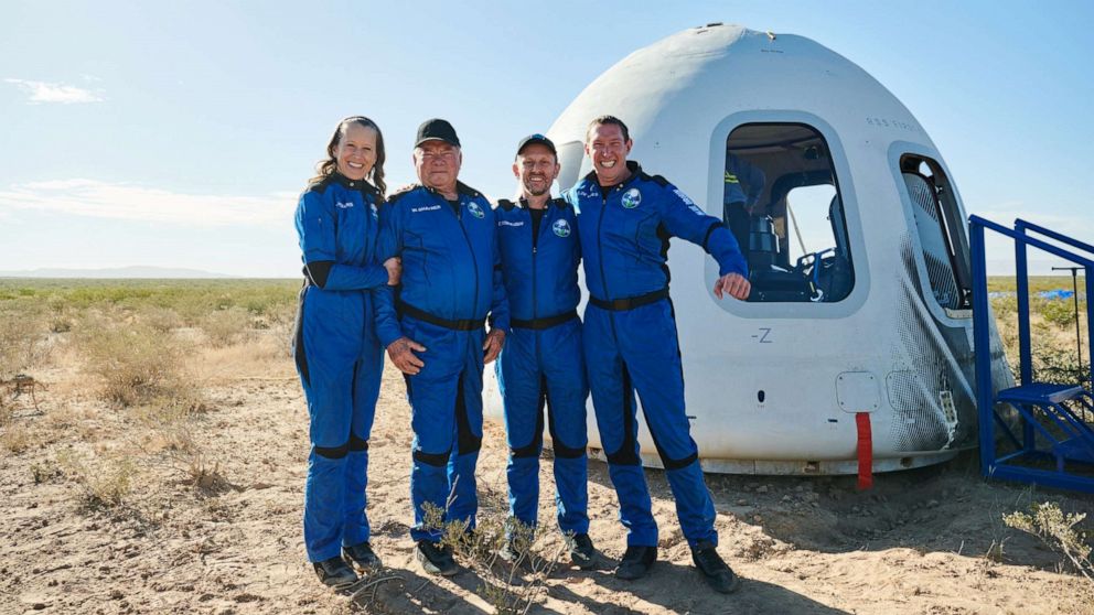 PHOTO: Star Trek actor William Shatner poses with Audrey Powers, Chris Boshuizen, and Glen de Vries after the capsule landing of the Blue Origin New Shepard mission NS-18 suborbital flight near Van Horn, Texas, Oct. 13, 2021.
