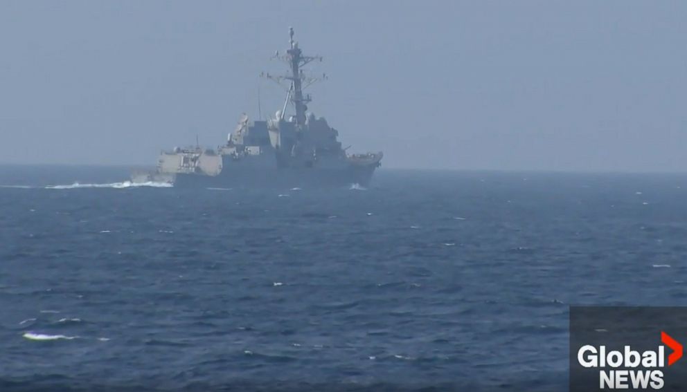 PHOTO: A Chinese warship appears to have intercepted the pair of U.S. and Canadian ships transiting through the Taiwan Strait overnight.