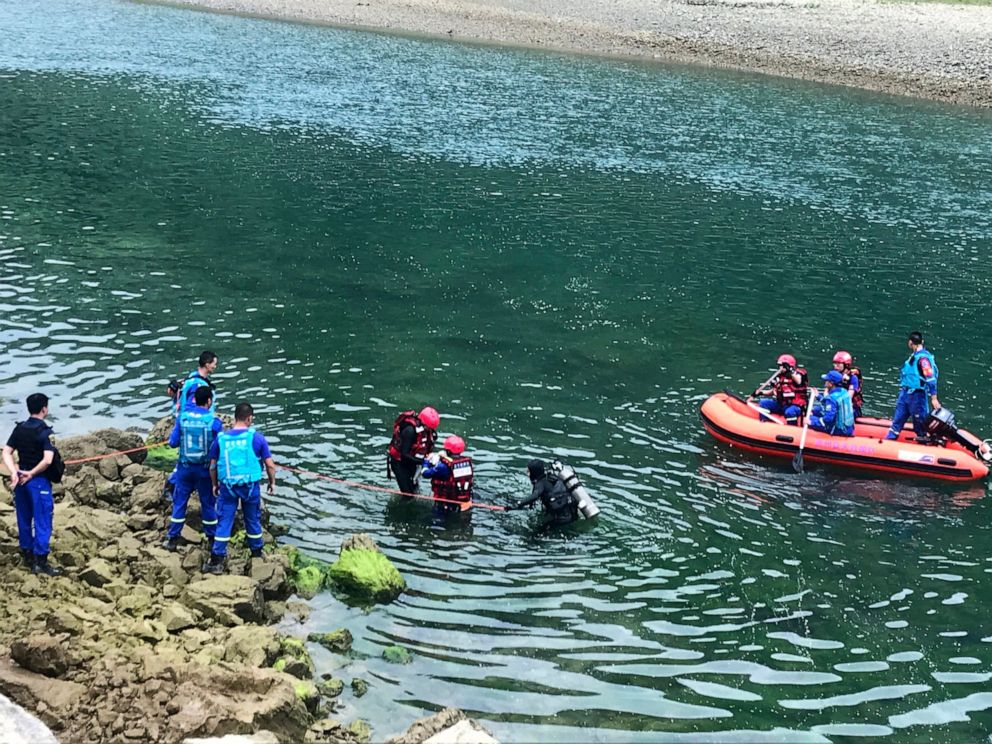 PHOTO: In this photo released by China's Xinhua News Agency, rescuers search a river after a boat capsized near Banrao village in southwestern China's Guizhou province, Friday, May 24, 2019.