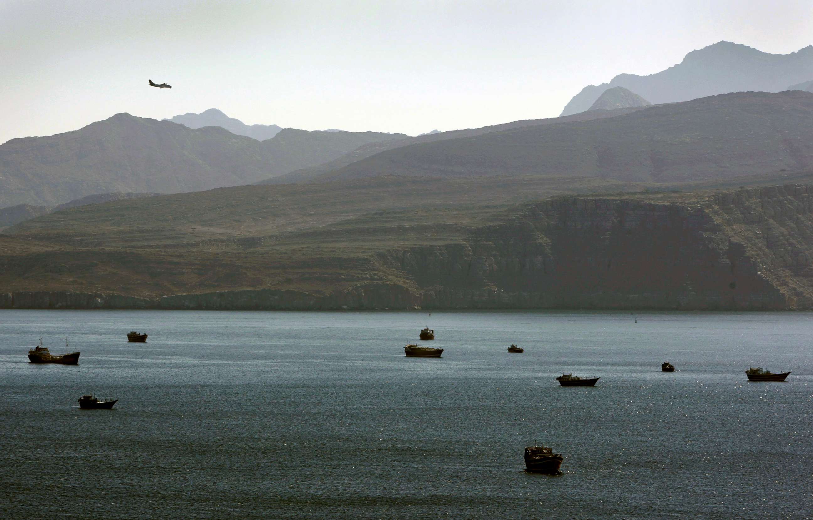 PHOTO: Trading dhows and ships are docked on the Persian Gulf waters near the town of Khasab, in Oman, Jan. 19, 2012.
