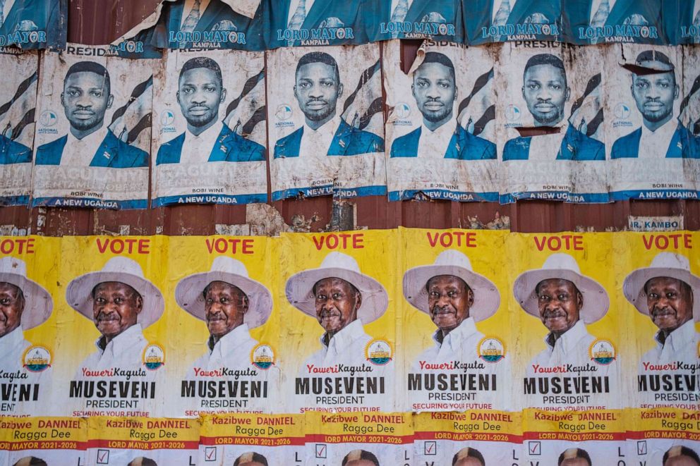 PHOTO: Posters of the two most popular candidates for Uganda's upcoming presidential election, incumbent President Yoweri Museveni and opposition leader Robert Kyagulanyi, also known as Bobi Wine, are seen on a street in Kampala, Uganda, on Jan. 6, 2021.